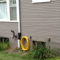 Where should downspouts end?